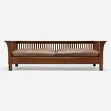 Spindle Prairie settle, model 234 by L. & J.G. Stickley, c. 1912, oak, leather, offered Jun 2024