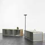 Manfred Pernice, Merzbank, 2004, two wooden shelves, mirrors, halogen lamp, paper box, ashtray, ceramic foot, vase and color laser prints