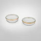Les Must de Cartier dishes, set of two by Claude Moliterni, offered Apr 2025
