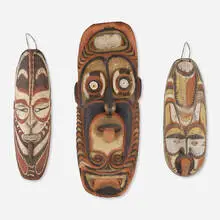 Sepik masks, set of three by Papuan, carved and pigmented wood, shells, offered May 2024