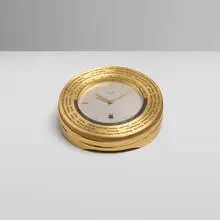 Hermès, World time desk clock, c. 1955, gilt brass, glass
