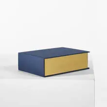 ME and THE by Ed Ruscha, 2002, cloth covered book with one-color fore-edge printing and gold leaf edges, sold Sep 2010