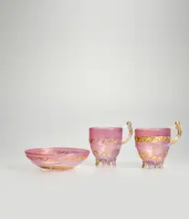 Pair of Cups and a Dish by Ermanno Nason, for Vetreria Gino Cenedese, ruby pink glass applied with gold leaf and meander decoration, sold Feb 2023