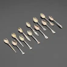 Tiffany & Co., Rare coffee spoons, set of twelve, 1907-1947, sterling silver parcel-gilt, mixed metals, enamel, niello (metal alloy inlays)