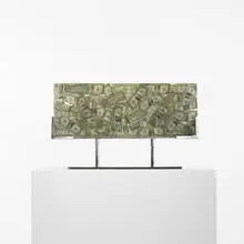 Arman, untitled, 1977-78, dollar bills encased in acrylic with chrome-plated steel base