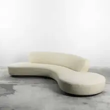 Serpentine sofa by Vladimir Kagan, c. 1955, upholstery over wood and foam, oak, sold Jun 2010