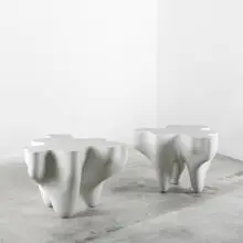 Puzzle tables, pair by Jean-Marie and Marthe Simonnet, polyester resin, sold Jun 2010
