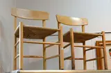 Borge Mogensen, A SET OF THREE J39 BEECH DINING CHAIRS, MANUFACTURED BY FBD MOBLER