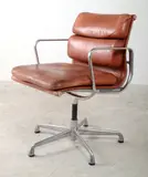 Charles Eames, RAY EAMES (1912-1988)A SOFT PAD ARMCHAIR, 1912, aluminium, leather