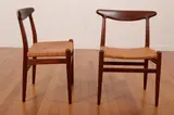 A SET OF SIX W2 DINING CHAIRS by Hans J. Wegner, teak, cane, sold Mar 2013