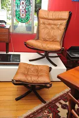Sigurd Ressell, A FALCON CHAIR AND OTTOMAN, designed 1973, 1973, bent laminated beech, leather, canvas, chromed metal