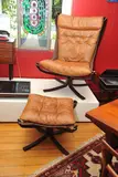 Sigurd Ressell, A FALCON CHAIR AND OTTOMAN, designed 1973, 1973, bent laminated beech, leather, canvas, chromed metal