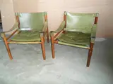 Arne Norell, A PAIR OF ROSEWOOD SAFARI CHAIRS, with original green leather upholstery
