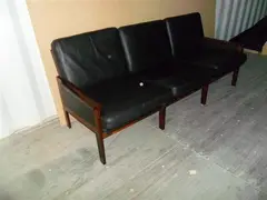 Illum Wikkelso, A DANISH ROSEWOOD AND BLACK LEATHER THREE SEAT SOFA, CIRCA 1960, 1960