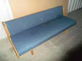 Hans J. Wegner, AN DANISH OAK DAYBED, with blue wool upholstery, adjustable backrest