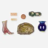 Collection of seven novelties and tags by George E. Ohr, c. 1900, bisque and glazed earthenware, sold Sep 2020