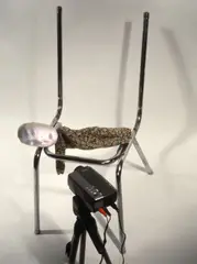 The Code by Tony Oursler, 1996, Videoinstallation: Stuhl aus Eisenrohr, Stoffigur, Stativ, Videoprojektor, sold May 2014