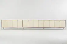 triple cabinet by Florence Knoll, c. 1965, walnut, lacquered caning, lacquered wood, stainless steel, sold Mar 2007