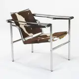 early Basculant chair by Charlotte Perriand and Le Corbusier Pierre Jeanneret, c. 1935, chrome-plated tubular steel, pony hide, leather, springs, sold Mar 2007