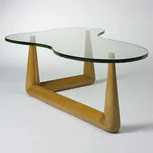 coffee table by T. H. Robsjohn-Gibbings, c. 1950, bleached walnut, glass, sold Mar 2007