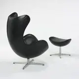Egg chair and ottoman by Arne Jacobsen, 1958, leather-upholstered fiberglass, aluminum, sold Mar 2007