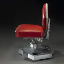 Junior Executive chair from Price Tower, Bartlesville, Oklahoma by Frank Lloyd Wright, 1956, cast aluminum, leather, enameled steel, sold Mar 2007