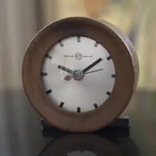 Gilbert Rohde, table clock, c. 1935, walnut, lacquered wood, glass, enameled metal