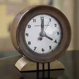Gilbert Rohde, table clock, c. 1935, walnut, beech, glass, enameled metal