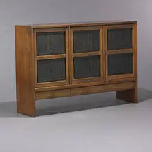 Chinese Block cabinet by Edward Wormley, c. 1957, walnut, rosewood print blocks, macassar ebony, brass, sold Mar 2007