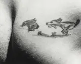 Dog chasing rabbit into hole: Tattoo Aboard US Mission bay, South Atlantic by Louis Clyde Stoumen, 1943, gelatin silver print, offered Jun 2021