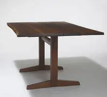 Trestle dining table by George Nakashima, c. 1960, American black walnut, rosewood, sold Oct 2006