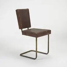 William Lescaze, chair, c. 1930, brass-plated steel, leather