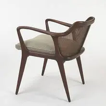 armchair by Vladimir Kagan, c. 1955, walnut, wicker, upholstery, sold Oct 2006