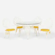 dining suite by Mathieu Matégot, c. 1960, enameled metal, glass, upholstery, painted rattan, sold Jul 2020