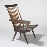 Slab armchair by George Nakashima, c. 1960, American black walnut, hickory, sold Oct 2006