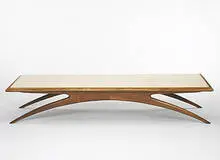 coffee table by Vladimir Kagan, c. 1955, walnut, travertine, sold Mar 2006
