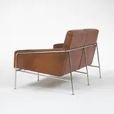 settee, model #3302 by Arne Jacobsen, c. 1956, leather, stainless steel, sold Mar 2006