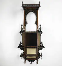 hanging wall shelf by Carlo Bugatti, c. 1900, walnut, ebonized walnut, mother of pearl, ivory, parchment, sold Mar 2006