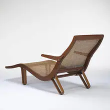 chaise lounge by Edward Wormley, c. 1956, walnut, cane, upholstery, sold Mar 2006