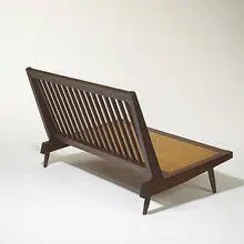 Four-foot settee by George Nakashima, c. 1965, American black walnut, upholstery, sold Mar 2006