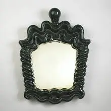 mirror by Georges Jouve, c. 1945, glazed stoneware, mirrored glass, sold Mar 2006