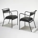 Jacques Adnet, armchairs, pair, c. 1950, leather over steel