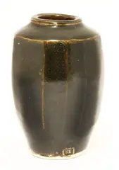 Bernard Leach (1887-1979) by Bernard Leach, a glazed and multifaceted vase, sold Oct 2017