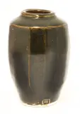 Bernard Leach (1887-1979) by Bernard Leach, a glazed and multifaceted vase, sold Oct 2017