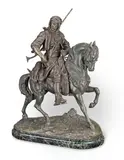 Alfred Barye, and Emile Guillemin (French, 1839-1882): A late 19th century French patinated spelter Orientalist equestrian group of an Arab Huntsman, patinated spelter