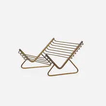 book rack by Carl Auböck, c. 1950, brass, sold Mar 2020
