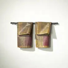 Anne Thulin, untitled (Towel Bar with Towels), 1992, steel, resin-coated newspaper