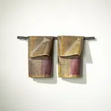 Anne Thulin, untitled (Towel Bar with Towels), 1992, steel, resin-coated newspaper