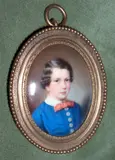 Continental School, A Young Boy, wearing buttoned blue smock with white collar and red bow-tie, oval gilt metal frame,