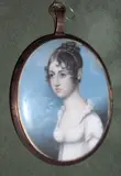 Attributed to I. or J. Fruman, A Young Lady, called Mary Chapmill, wearing white dress with frilled collar, her brown hair curled and upswept yellow metal oval frame, the rear with woven hair, and applied paper label inscribed 'Mary Chapmill wife of John gaordid le scout'